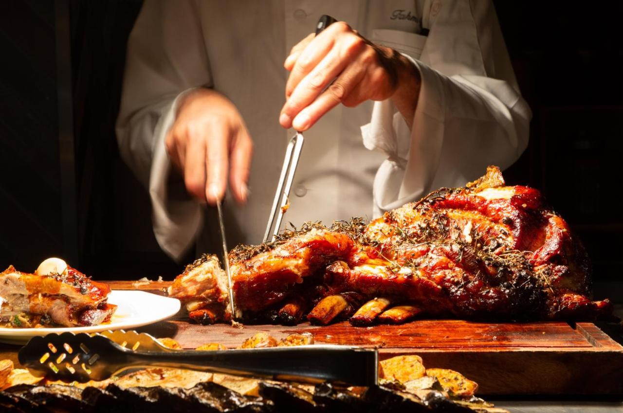 Nevo By Isrotel Collection Ein Bokek Dış mekan fotoğraf A chef carving a roast